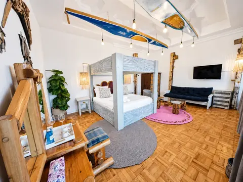 SeaViu Manta suite with a king bed and handcrafted interiors
